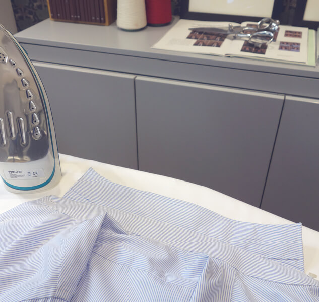 Ironing the collar of a shirt