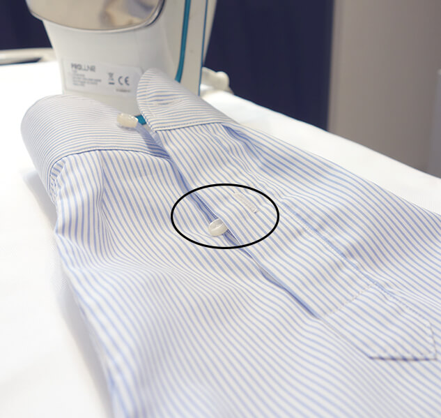 Ironing the sleeve placket of a shirt