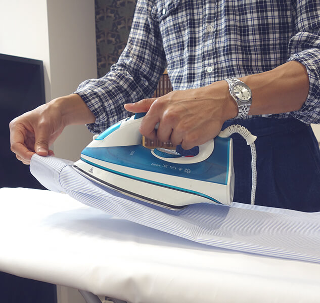 Ironing the cuff pleats of a shirt